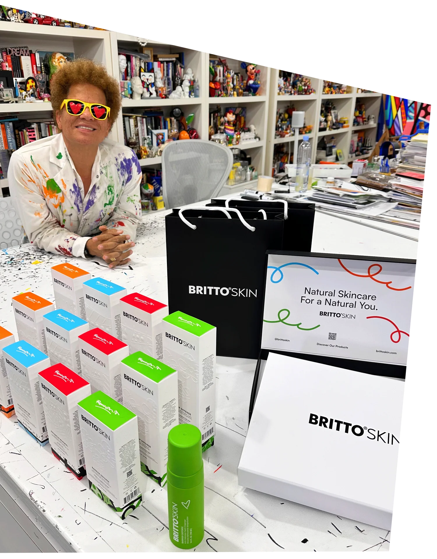 The famous artist Romero Britto, proudly smiles as he showcases his new Skincare Line.
